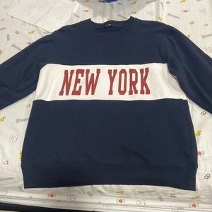 this sweatshirt is a size small and has a regular fit